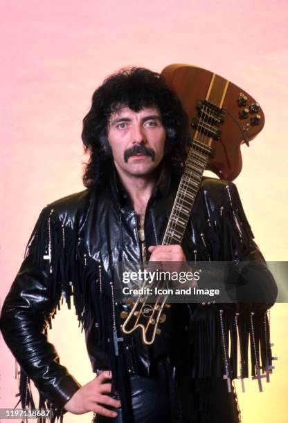 English songwriter, producer, lead guitarist and founding member of the heavy metal band Black Sabbath, Tony Iommi, poses for a portrait backstage at...