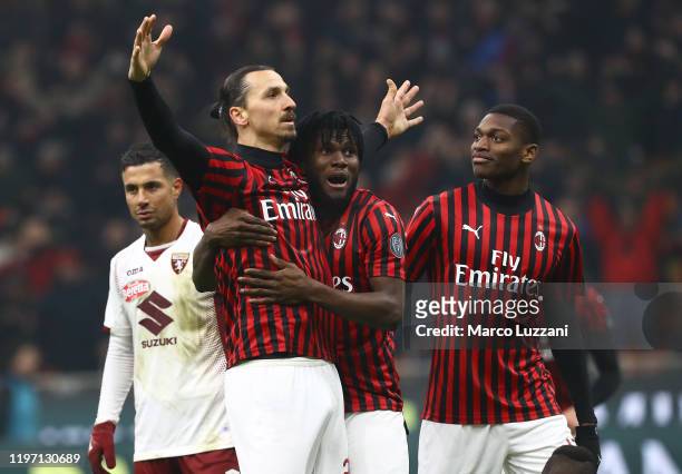Zlatan Ibrahimovic of AC Milan celebrates his goal with his team-mates Franck Kessie and Rafael Leao during the Coppa Italia Quarter Final match...