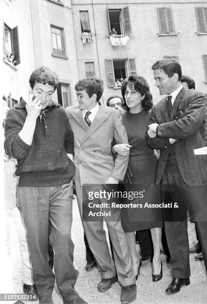 Italian actress Anna Magnani arm in arm with Italian director and writer Pier Paolo Pasolini and Italian actor Ettore Garofolo beside Italian actor...