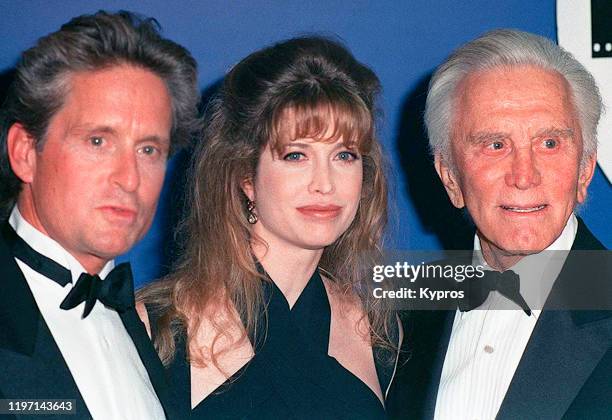 American actor Kirk Douglas with his son, actor Michael Douglas and Michael's wife Diandra, circa 1993.