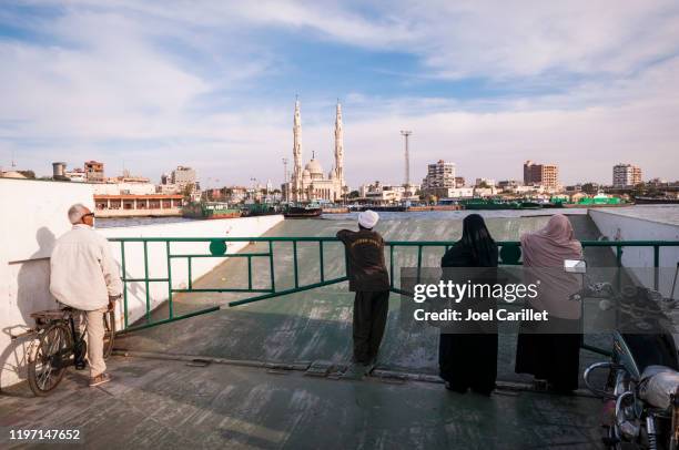 port said to port fuad ferry across the suez canal in egypt - port said stock pictures, royalty-free photos & images