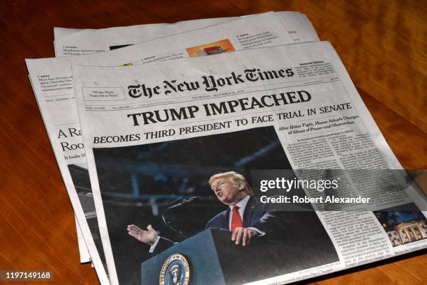 The December 19, 2019 edition of The New York Times with a headline 'Trump Impeached'.