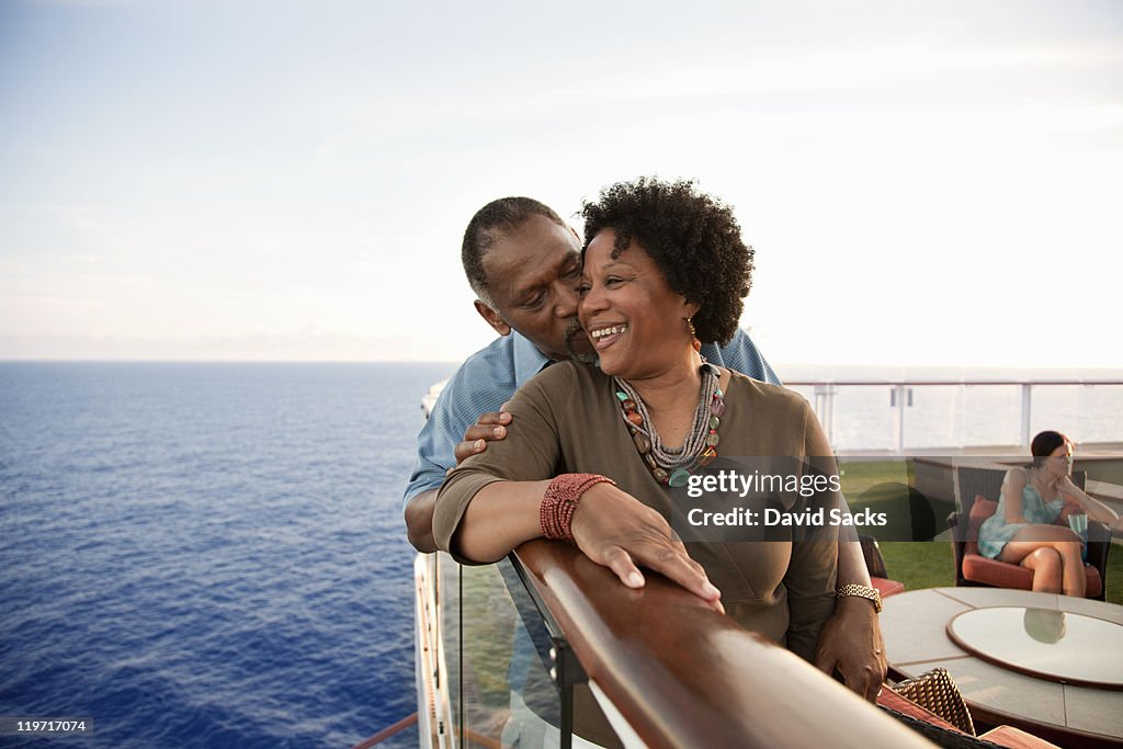 Couple on railing on deck