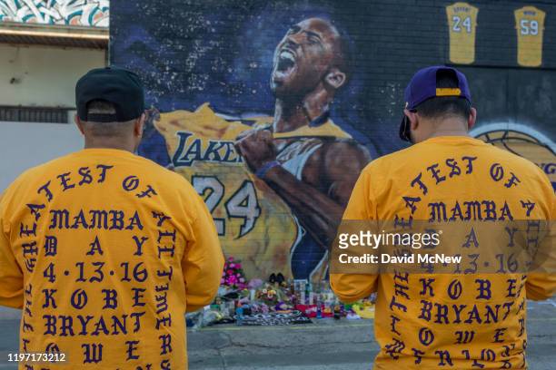 Fans visit a mural of former NBA star Kobe Bryant who, along with his 13-year-old daughter Gianna, died January 26 in a helicopter crash, on January...
