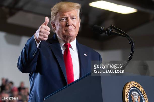 President Donald Trump gives a thumbs up during a "Keep America Great" campaign rally at Wildwoods Convention Center in Wildwood, New Jersey, January...