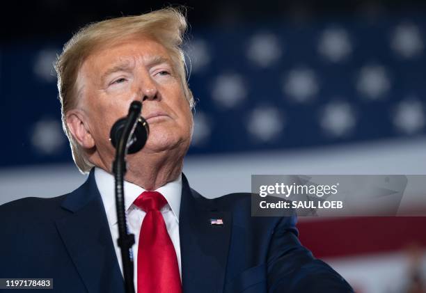 President Donald Trump looks on during a "Keep America Great" campaign rally at Wildwoods Convention Center in Wildwood, New Jersey, January 28, 2020.