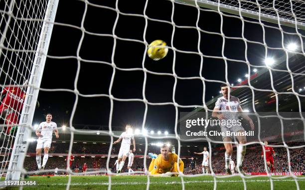 Sadio Mane of Liverpool scores his team's second goal as Chris Basham, Dean Henderson and John Egan of Sheffield United react during the Premier...