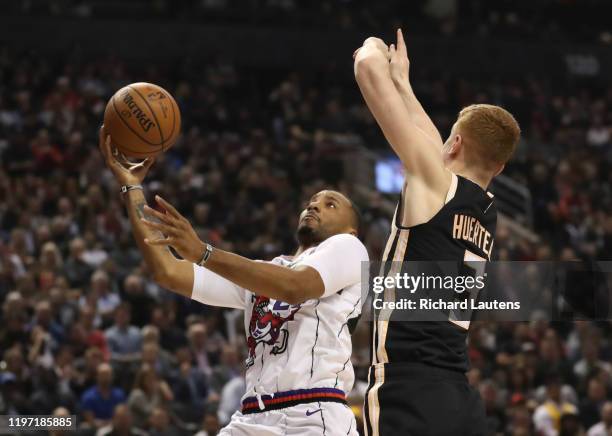 January 28 In first half action, Toronto Raptors guard Norman Powell drives to the hoop around the defence of Atlanta Hawks guard Kevin Huerter The...