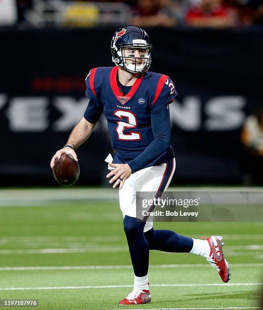 McCarron of the Houston Texans scrambles out of the pocket looking for a receiver during the fourth quarter against the Tennessee Titans at NRG...