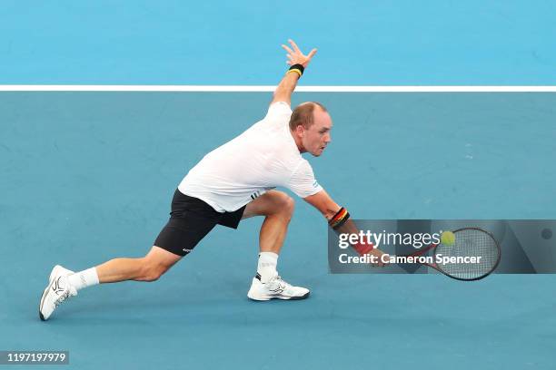 Steve Darcis of Belgium plays a backhand during the Group C singles match between Steve Darcis of Belgium and Alexander Cozbinov of Moldova during...