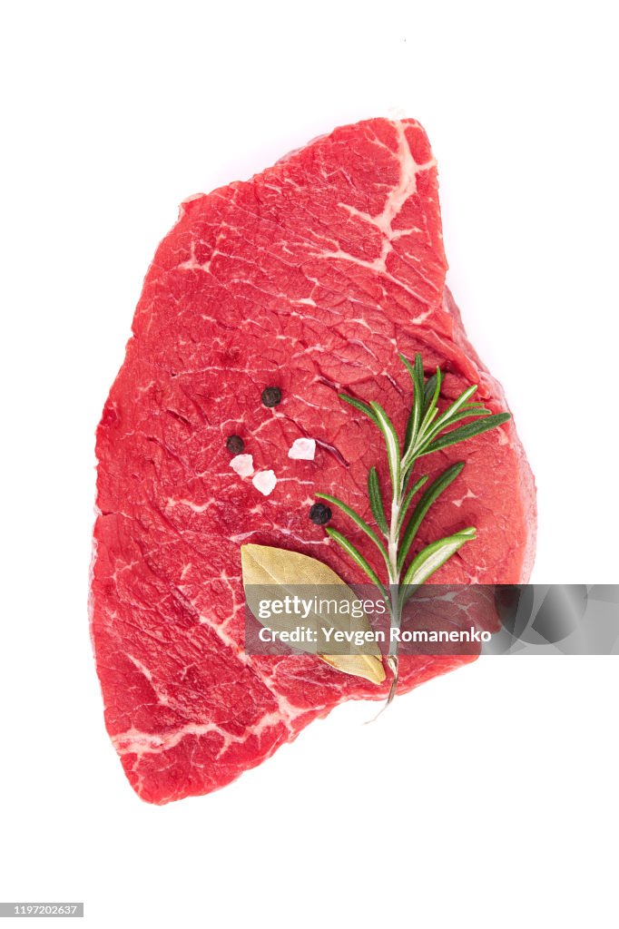 Fresh Raw Meat with rosemary and pepper, isolated on white background