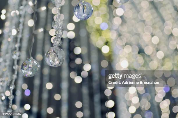 defocused chandelier crystals - crystal chandelier stock pictures, royalty-free photos & images