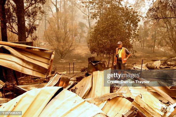 Sarsfield resident Wayne Johnston inspects damage to his property on January 03, 2020 in Sarsfield , Australia. Wayne evacuated to the town of...