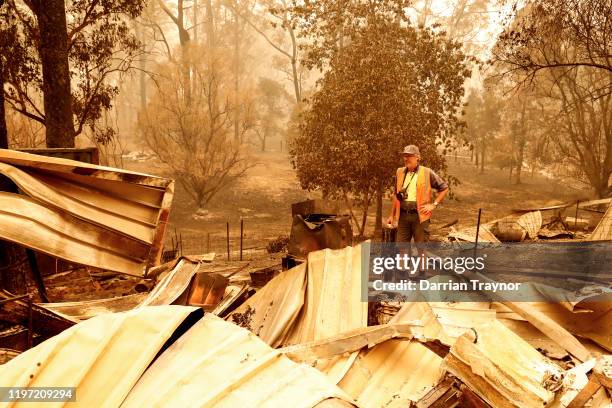 Sarsfield resident Wayne Johnston inspects damage to his property on January 03, 2020 in Sarsfield , Australia. Wayne evacuated to the town of...