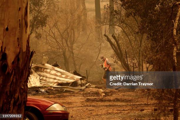 Sarsfield resident Wayne Johnston inspects damage to his property on January 03, 2020 in Sarsfield , Australia. Wayne evacuated to the town of...