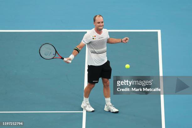 Steve Darcis of Belgium celebrates winning match point during the Group C singles match between Steve Darcis of Belgium and Alexander Cozbinov of...