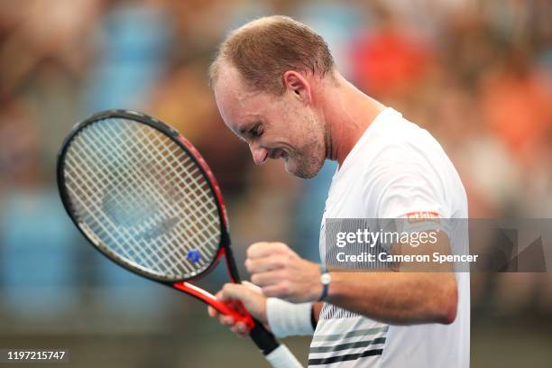 Steve Darcis of Belgium celebrates winning match point during the Group C singles match between Steve Darcis of Belgium and Alexander Cozbinov of...