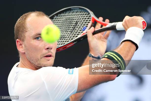 Steve Darcis of Belgium plays a backhand during the Group C singles match between Steve Darcis of Belgium and Alexander Cozbinov of Moldova during...