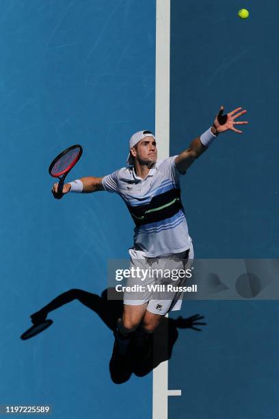 John Isner of USA serves to Casper Ruud of Norway in the mens singles match during day one of the 2020 ATP Cup Group Stage at RAC Arena on January...