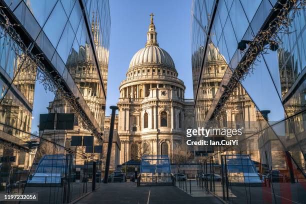 st paul's cathedral with reflections during sunrise - central london stock pictures, royalty-free photos & images