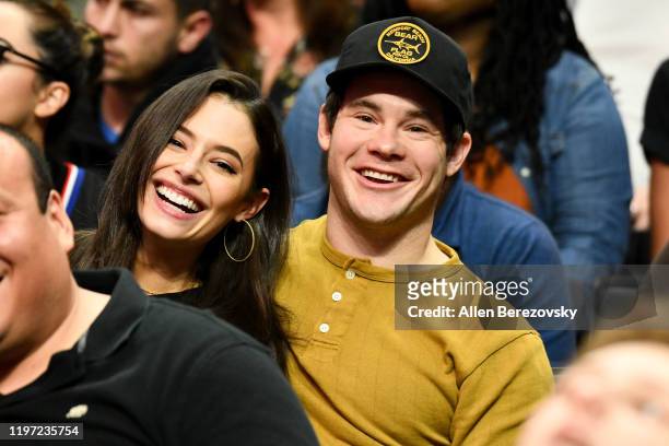 Chloe Bridges and Adam DeVine attend a basketball game between the Los Angeles Clippers and the Detroit Pistons at Staples Center on January 02, 2020...