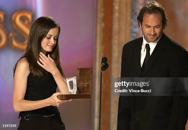Actress Alexis Bledel accepts the award for "Actress" for her role in "Gilmore Girls" from fellow cast member Scott Patterson at the 4th Annual...