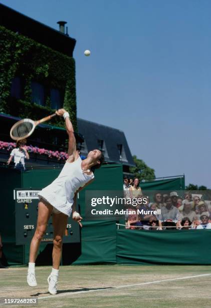 Virginia Wade of Great Britain serves to Peggy Michel during their Women's Singles Third Round match at the Wimbledon Lawn Tennis championships on...