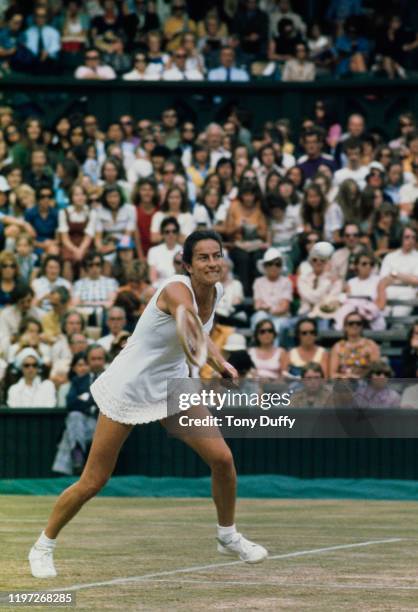 Virginia Wade of Great Britain makes a forehand return to Evonne Goolagong Cawley during their Women's Singles Quarter-Final match against at the...