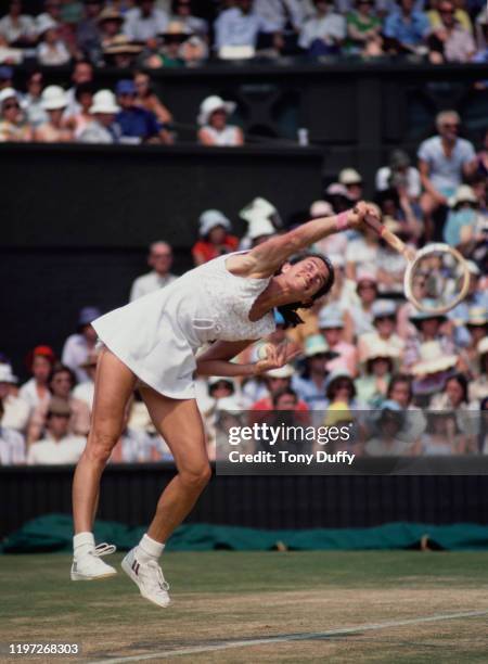 Virginia Wade of Great Britain serves to Evonne Goolagong Cawley during their Women's Singles Semi-Final match against at the Wimbledon Lawn Tennis...