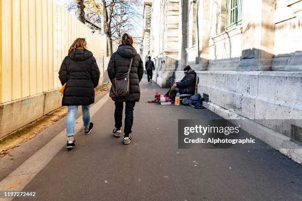 2019 homelessness in paris - homeless woman stock pictures, royalty-free photos & images