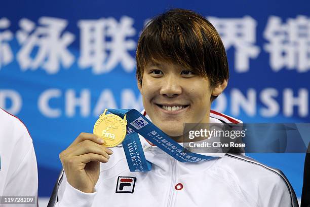 Tae Hwan Park of Korea poses with his gold medal after the Men's 400m Freestyle Final during Day Nine of the 14th FINA World Championships at the...