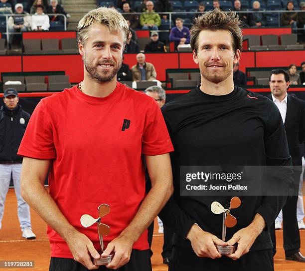 Oliver Marach of Austria and Alexander Peya of Austria are celebrating with their cups after winning their semi doubles final match against Frantisek...