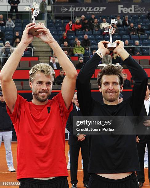 Oliver Marach of Austria and Alexander Peya of Austria are celebrating with their cups after winning their semi doubles final match against Frantisek...