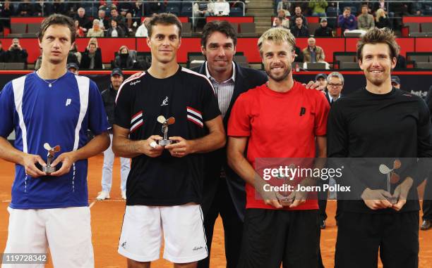 Oliver Marach of Austria and Alexander Peya of Austria are celebrating with their cups after winning their semi doubles final match against Frantisek...