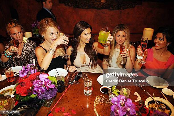 Kim Kardashian and Kourtney Kardashian attend Kim Kardashian's bachelorette dinner at TAO Bistro at the Venetian on July 23, 2011 in Las Vegas,...