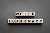 White supremacy - words from wooden blocks with letters