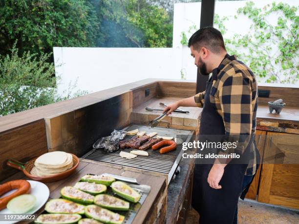 Man Using Grill 1,691 Outdoor Kitchen Grill Stock Photos, High-Res Pictures, and Images ...