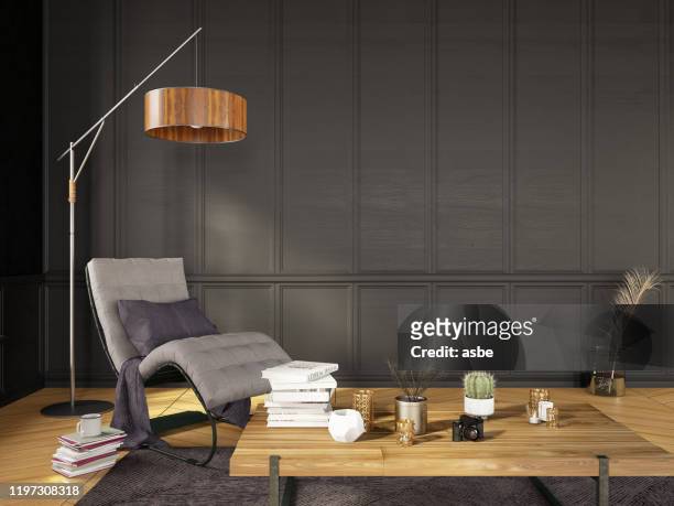 moderno salón detalle sillón con lámpara de pie y libros - mesa baja de salón fotografías e imágenes de stock