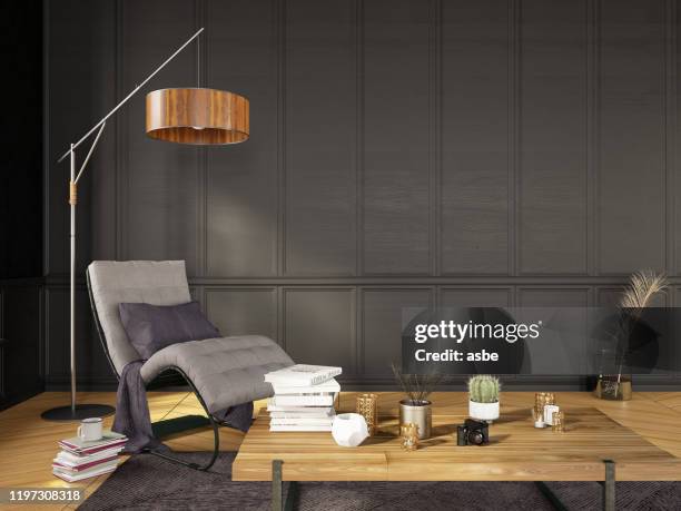 modern living room detail armchair with floor lamp and books - coffee table stock pictures, royalty-free photos & images