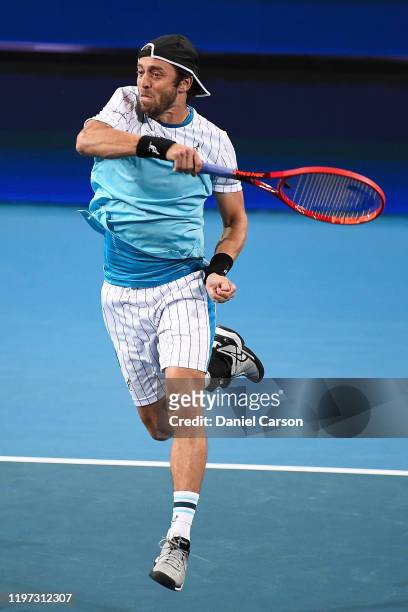 Paolo Lorenzi of Team Italy plays a forehand shot in his doubles match vs Team Russia during day one of the 2020 ATP Cup Group Stage at RAC Arena on...