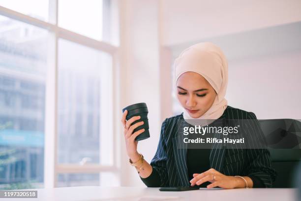 Muslim Businesswomen with Coffee Cup