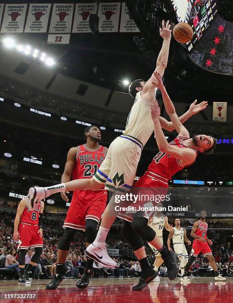 Tomas Satoransky of the Chicago Bulls fouls Ersan Ilyasova of the Milwaukee Bucks at the United Center on December 30, 2019 in Chicago, Illinois....