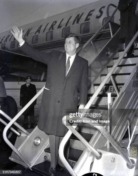 American politician, United States senator from Massachusetts and 35th president of the United States, John Fitzgerald Kennedy , boards an airplane...