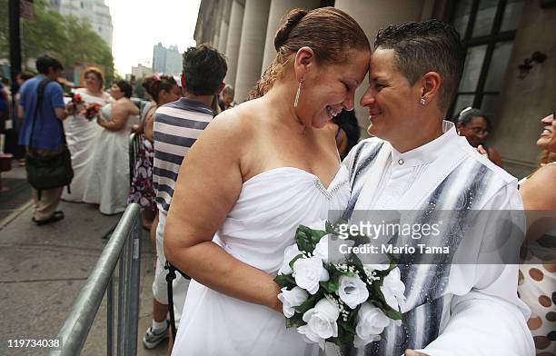 Maira Garcia and Maria Vargas wait on line to get married at the Brooklyn City Clerk's office on July 24, 2011 in New York City. Today was the first...