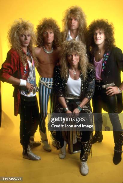 Whitesnake, the hard rock band formed in England in 1978, poses for a portrait backstage at the Joe Louis Arena while they were the opening act for...