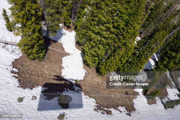 aerial tram shadow cast on snow covered land below - jackson hole mountain resort stockfoto's en -beelden