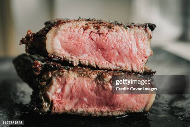 medium rare steak cut in half - beef steak stock pictures, royalty-free photos & images