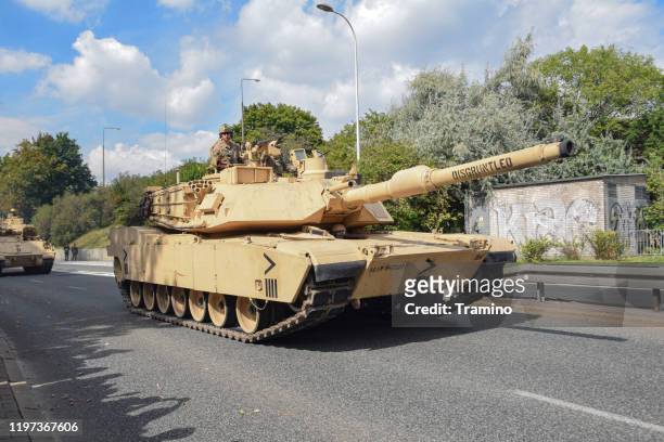 american tank abrams driving on a street - m1 abrams stock pictures, royalty-free photos & images