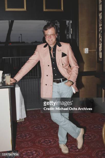 American actor, screenwriter and director Robert Culp wearing a Walt Disney jacket with Mickey and Minnie Mouse on the lapel, 1981.