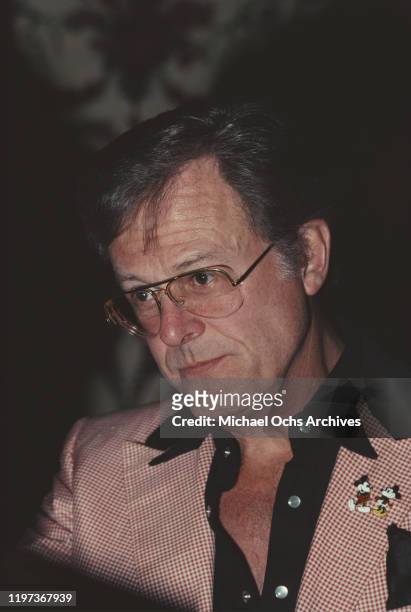 American actor, screenwriter and director Robert Culp wearing a Walt Disney jacket with Mickey and Minnie Mouse on the lapel, 1981.